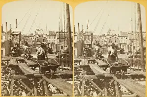 Bennett H H Prints: Unloading Coal, 1880 / 89. Creator: Henry Hamilton Bennett