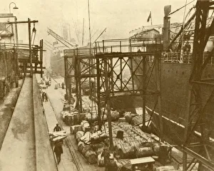 Dockside Prints: Unloading Foodships at the Royal Albert Docks, London, c1930. Creator: Unknown