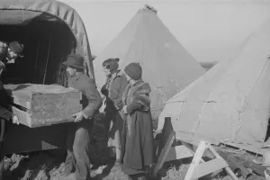 Bad Weather Gallery: Unloading household goods of a family of white flood refugees in camp, Forrest City, Arkansas, 1937