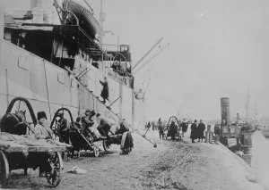 Carts Prints: Unloading SEATTLE, Archangel, between c1915 and c1920. Creator: Bain News Service
