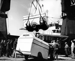 Dock Worker Prints: Unloading trailers from a ship, (c1950s?)