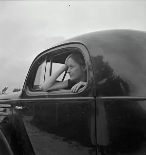 Traveller Collection: Untitled, 1935-1942. [Woman in a car]. Creator: Unknown