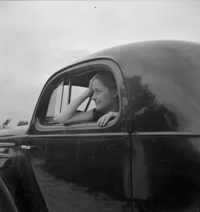 Untitled, 1935-1942. [Woman in a car]. Creator: Unknown