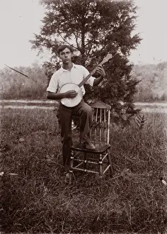Banjo Player Prints: Untitled (man with banjo, neg, #1), c1931, printed c1975. Creator: Wendell Hotter