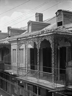 Upper story of building with wrought iron balconies, New Orleans, between 1920 and 1926. Creator: Arnold Genthe