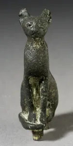 Late Period Prints: Upright Seated Cat Figurine, Late Period-Ptolemaic Period (711-30 BCE). Creator: Unknown