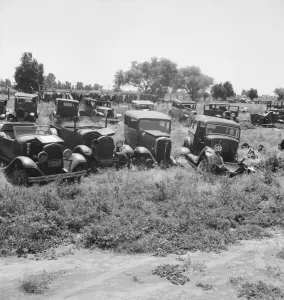 Used car lots and auto wrecking establishments, U. S. 99, Near Tulare, California, 1939. Creator: Dorothea Lange