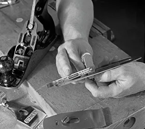 Stanley Tools Prints: Using an adjustment gauge on a Stanley plane, 1968. Artist: Michael Walters
