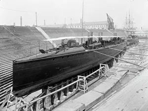 Graving Dock Prints: U.S.S. Ericsson in dry dock, Brooklyn Navy Yard, between 1897 and 1901. Creator: Unknown