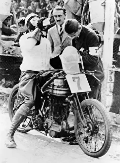 Norton Prints: Van Horne taking a drink whilst on his Norton bike