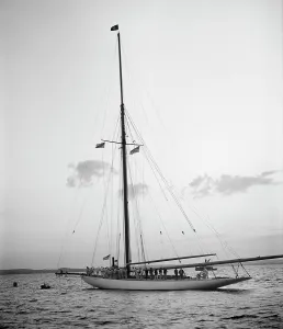Ng Herreshoff Prints: Victorious Columbia at mooring in the horseshoe after race of Oct
