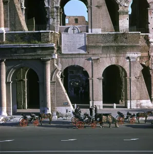 View of the Colosseum with cabs in front