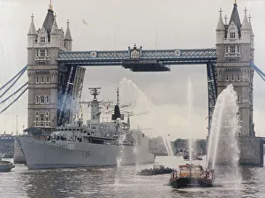 London Landmarks Collection: View of HMS London sailing beneath Tower Bridge, London, 1988