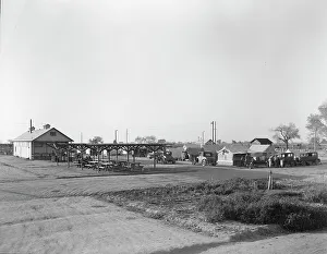 Sanitation Prints: View of Kern migrant camp showing outdoor clubroom with protection from the sun