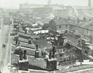 Backyard Gallery: View across roof tops to Pinks Factory, Tabard Street, Southwark, London, 1916