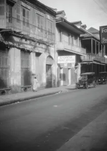 Creole Prints: View down a street, New Orleans, between 1920 and 1926. Creator: Arnold Genthe