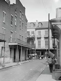 Multi Storey Prints: View down a street, New Orleans, between 1920 and 1926. Creator: Arnold Genthe