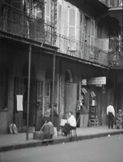 Grocers Prints: View from across street of people under a covered sidewalk
