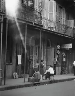 Grocers Prints: View from across street of two women talking