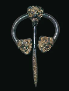 Kobenhavn Prints: Viking gilded bronze dress fastener, 9th century