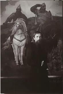 Viktor Vasnetsov before his painting Bogatyrs. Artist: Anonymous
