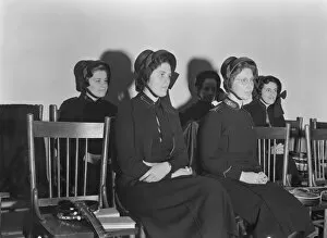 Uniforms Gallery: Visiting lassies sit on rostrom, Salvation Army, San Francisco, California, 1939