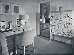 W. & J. Sloane. Photographers hobby room showing a desk in natural oak, a hand-woven