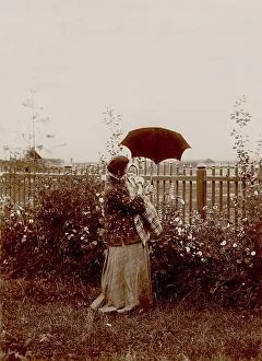 Flower Bed Prints: A walk in the garden at the Yudins dacha in Tarakanovo, 1903. Creator: Unknown