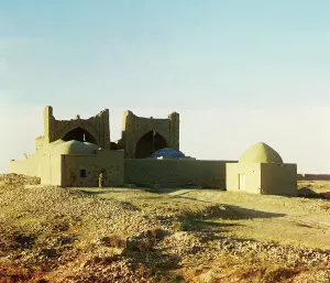 Central Asian Prints: Walled adobe structure with domes and arches in desert area