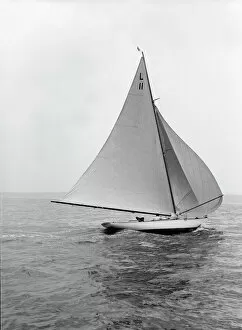 8 Metre Collection: Wamba II running downwind under spinnaker, 1914. Creator: Kirk & Sons of Cowes