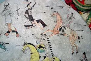 Detail of a war shield showing North American Indians in battle