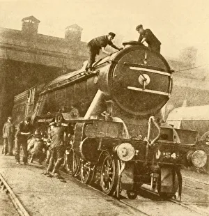 Cleaning Prints: A Wash and Brush Up for the Flying Scotsman. c1930. Creator: Unknown