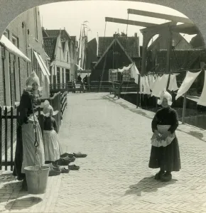 North Holland Prints: Washday in Volendam, Netherlands - Shoes Large and Small and Some Who Wear Them, c1930s