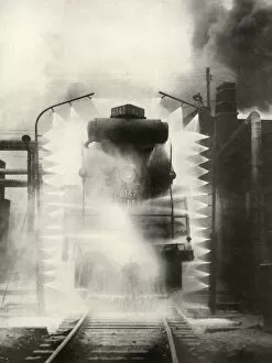 Black Smoke Gallery: Washing A Locomotive on the Canadian National Railway, at Montrea, 1935. Creator: Unknown