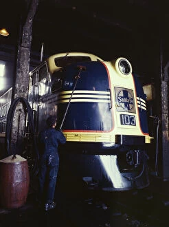 Diesel Gallery: Washing one of the Santa Fe R.R. 54 hundred horse power diesel freight...Argentine, Kansas, 1943