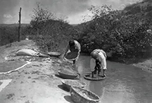 Subsistence Prints: Washing wheat-San Juan, c1905. Creator: Edward Sheriff Curtis