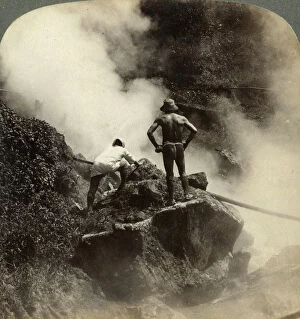 Watching an eruption of steam and boiling mud halfway up the volcano of Aso-san, Japan, 1904