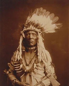 Feathers Collection: Weasel Tail-Piegan, c1900. Creator: Edward Sheriff Curtis