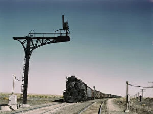 Atchison Topeka Santa Fe Railway Gallery: West bound Santa Fe R.R. freight train waiting in a siding... Ricardo, New Mexico, 1943