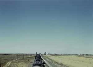 Westbound freight train stopping for water, Melrose, New Mexico, 1943. Creator: Jack Delano