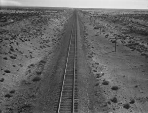 Arid Collection: Western Pacific line runs through unclaimed desert of northern Oregon, 1939. Creator: Dorothea Lange
