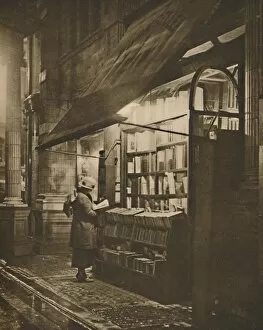 Bookshelves Gallery: Wet Winter Evening and a Book Lover in Bloomsbury, c1935. Creator: Fincham