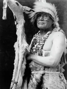 Face Paint Prints: White deerskin dance costume-Hupa, c1923. Creator: Edward Sheriff Curtis