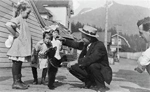 Settlers Prints: White people with bear cub, between c1900 and c1930. Creator: Unknown