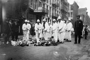 Sweeping Prints: White Wings under police protection, 1911. Creator: Bain News Service