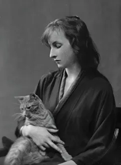 Bathrobe Prints: Whittaker, Miss, with Buzzer the cat, portrait photograph, 1916. Creator: Arnold Genthe