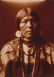 Earring Collection: The wife of Ow High, c1905. Creator: Edward Sheriff Curtis