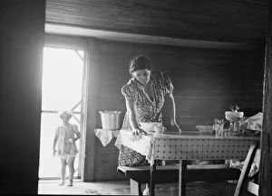 Wife of tobacco sharecropper in kitchen of home, Person County, North Carolina, 1939. Creator: Dorothea Lange