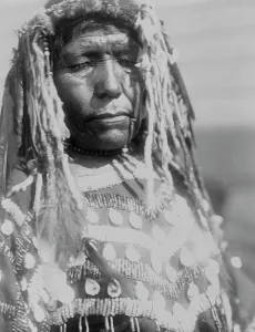 Blackfeet Prints: Wife of Weasel Head-Piegan, c1910. Creator: Edward Sheriff Curtis