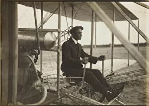 Natural Philosophy Gallery: Wilbur Wright in the flyer, 1908. Creator: Anonymous